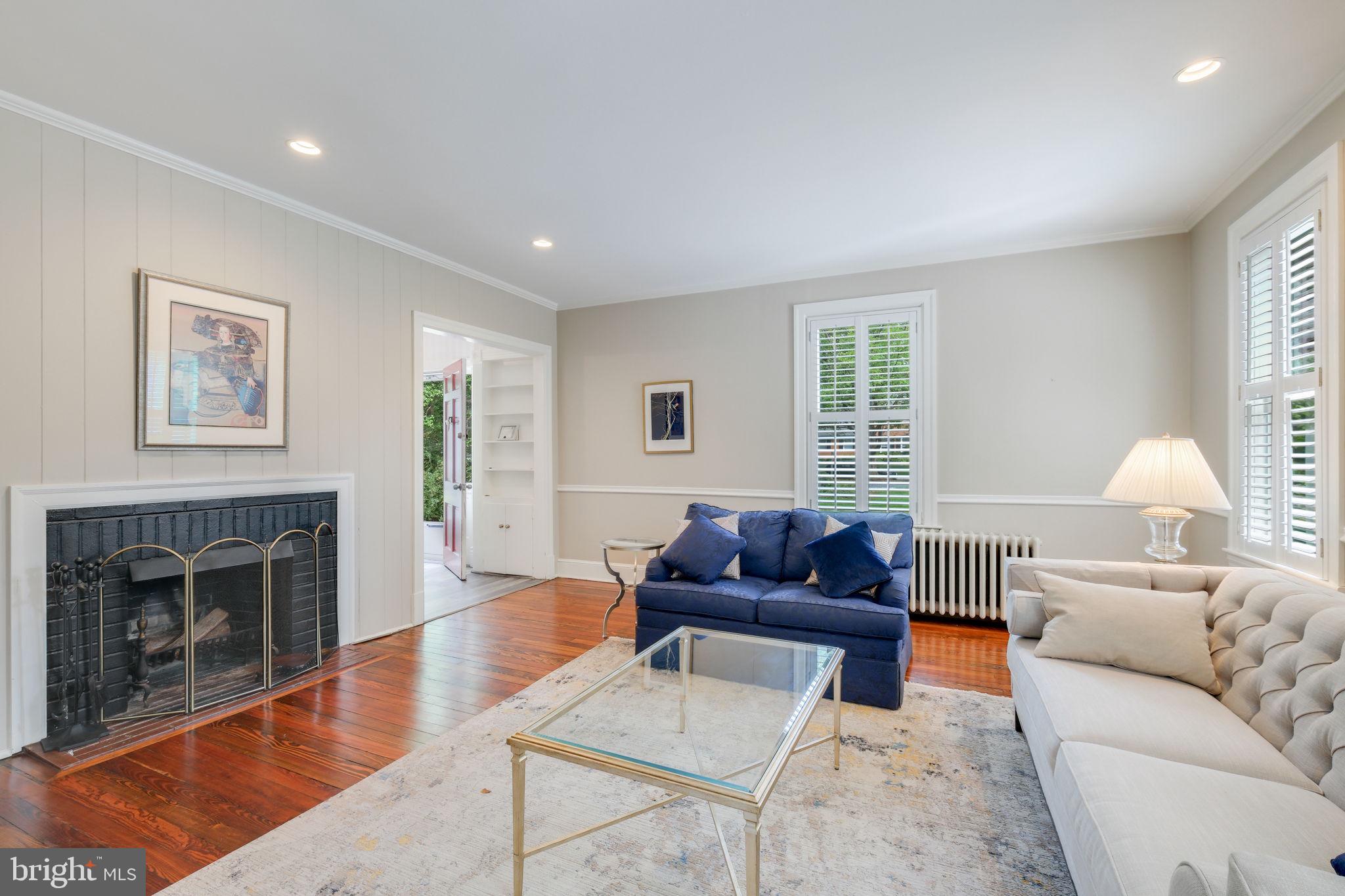 6220 Mazwood Road Rockville, MD 20852 - Photo 7 of 47 a living room with furniture a window and a fireplace