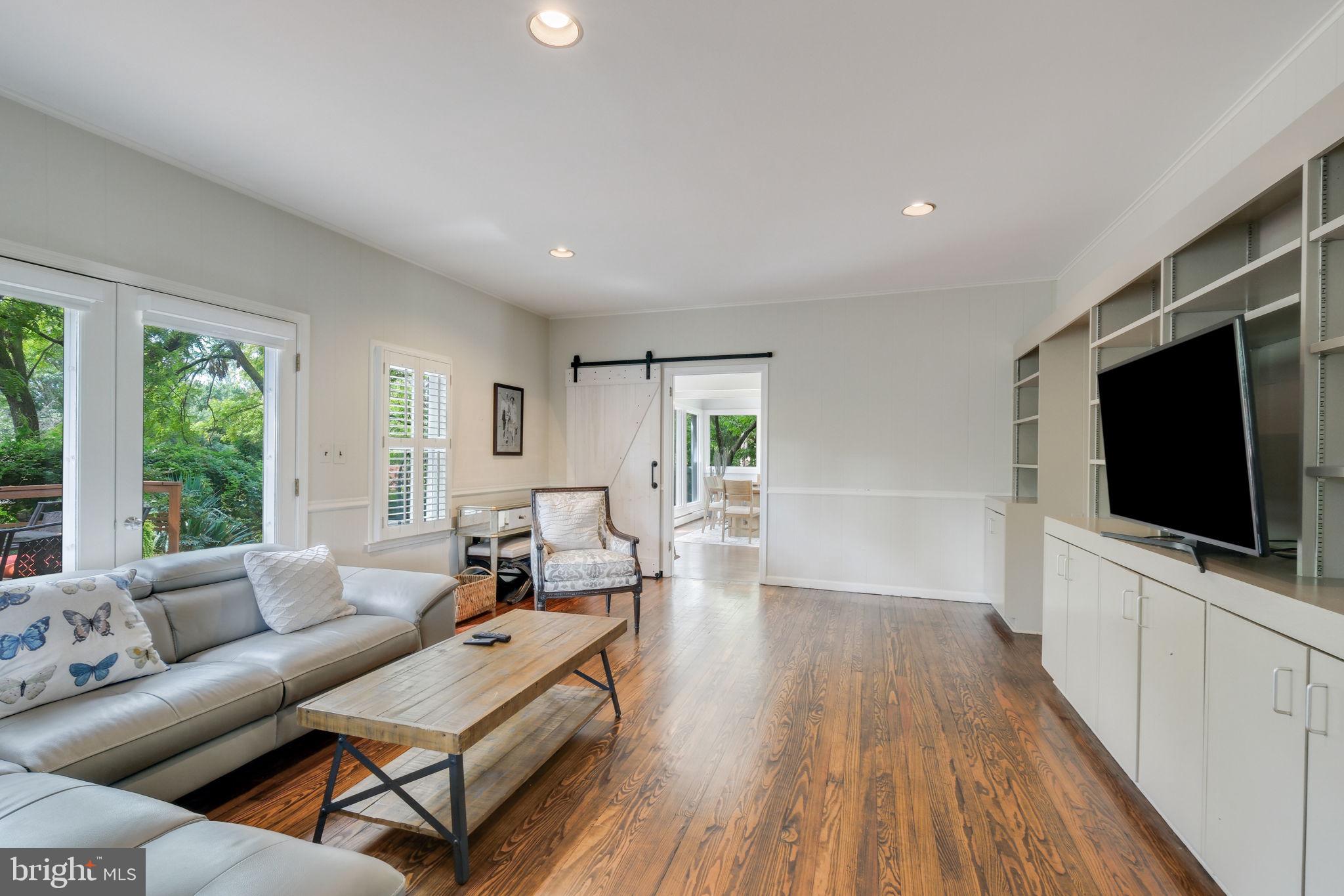 6220 Mazwood Road Rockville, MD 20852 - Photo 8 of 47 a living room with furniture and a flat screen tv