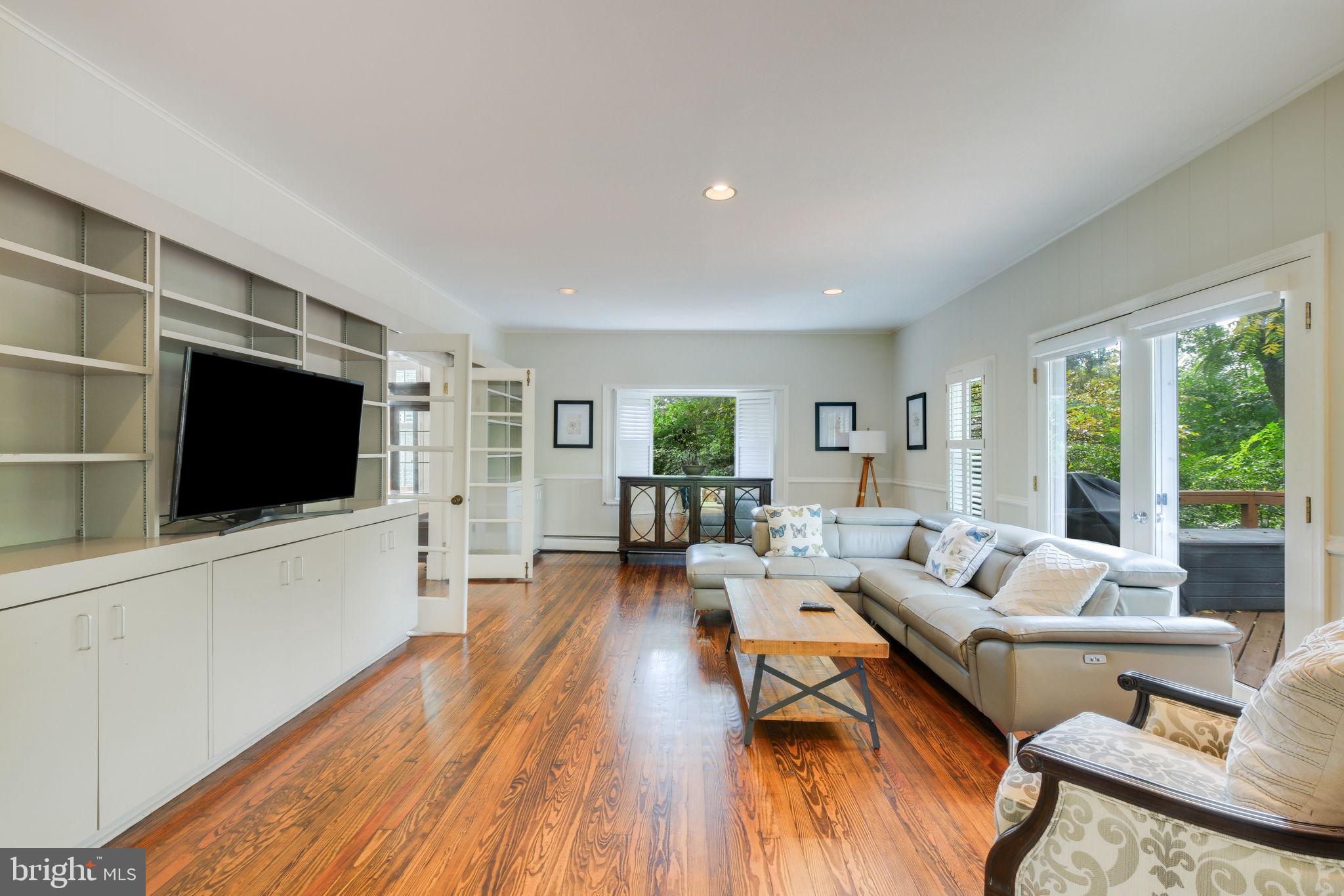 6220 Mazwood Road Rockville, MD 20852 - Photo 9 of 47 a living room with furniture and a flat screen tv