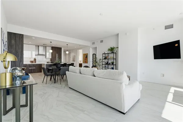 a front view of a house with wooden floor and furniture