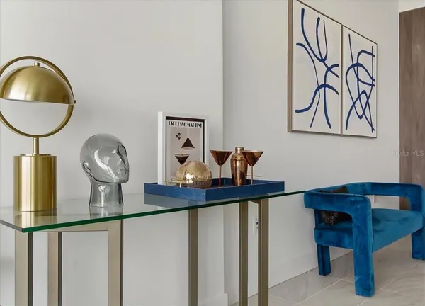 a living room with furniture and kitchen view