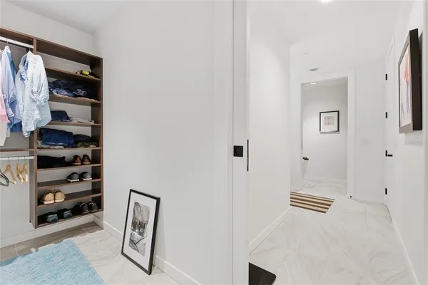 a bathroom with a toilet and a shower curtain
