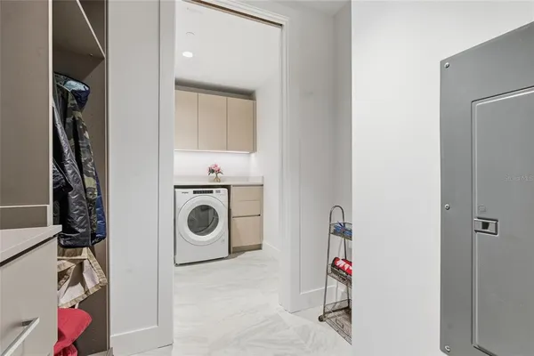 a bedroom with two beds and a couch