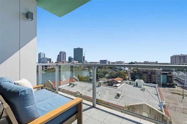 a view of room with stairs and a rug
