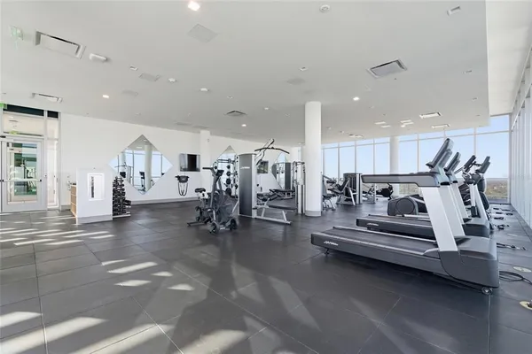 a view of a patio with swimming pool table and chairs