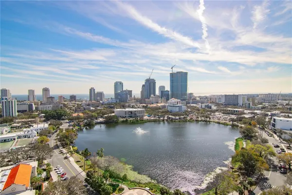 a view of a patio with table and chairs a barbeque
