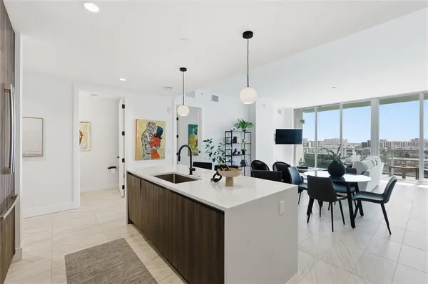 a dining room with furniture and wooden floor