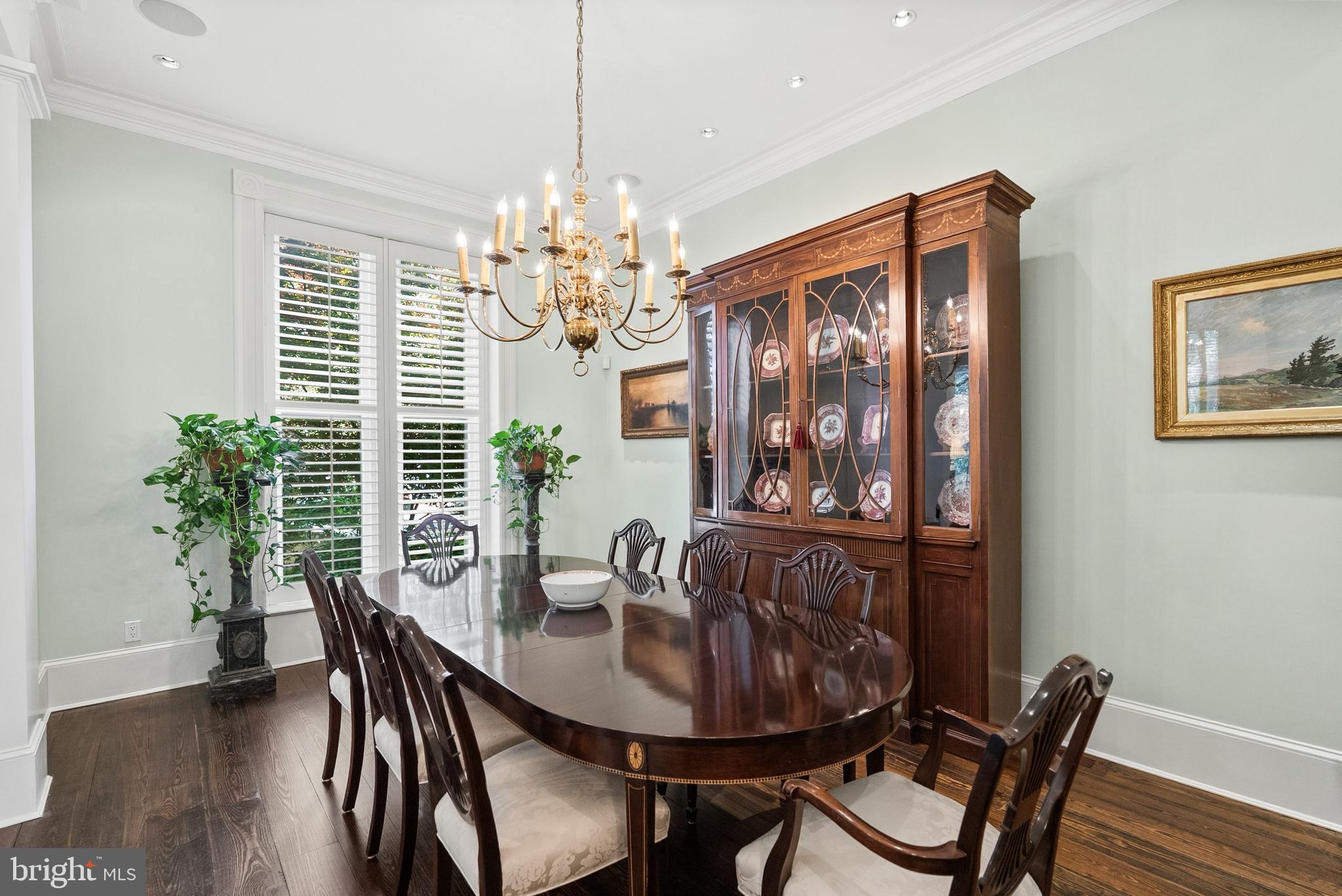 1601 28th Street Northwest Washington, DC 20007 - Photo 9 of 29 a view of a dining room with furniture wooden floor and chandelier