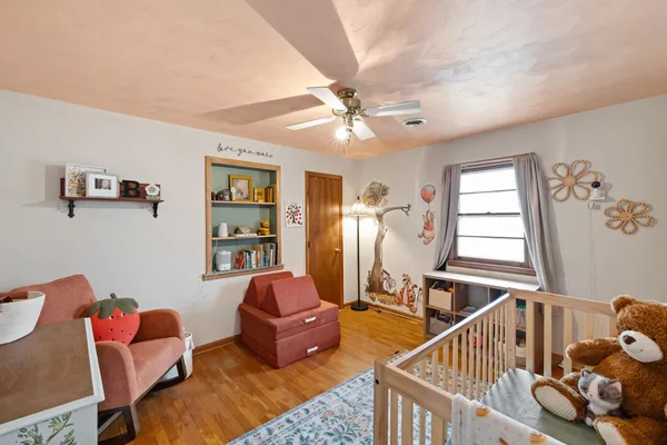 a bedroom with furniture and a window
