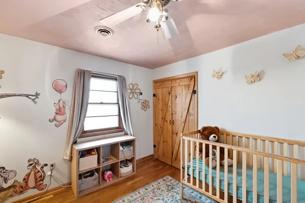 a bathroom with a sink and mirror with toilet