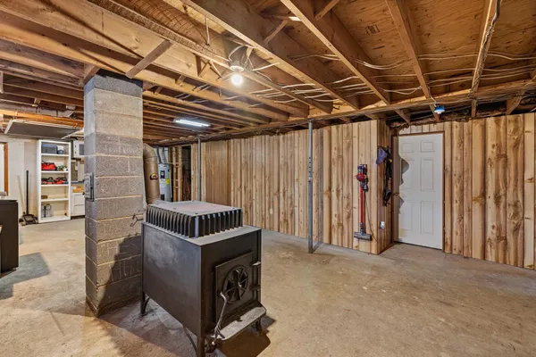 a blue bench sitting in middle of a yard