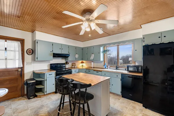 a kitchen with lots of counter top space and appliances