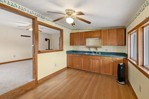 a kitchen with stainless steel appliances granite countertop a stove and a refrigerator