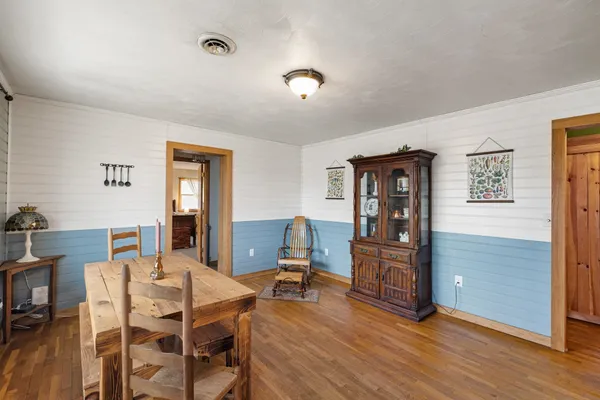 a view of a livingroom with furniture window and wooden floor