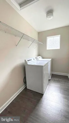 a bathroom with a granite countertop bathtub sink and mirror