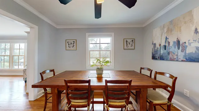 a view of a dining room with furniture and window