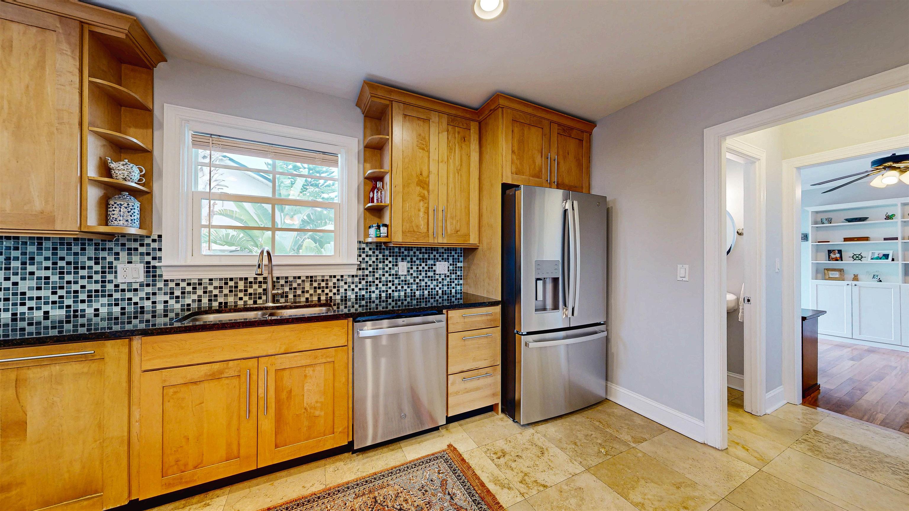 312 Minorca Avenue St. Augustine, FL 32080 - Photo 15 of 56 a kitchen with stainless steel appliances granite countertop a refrigerator and a sink
