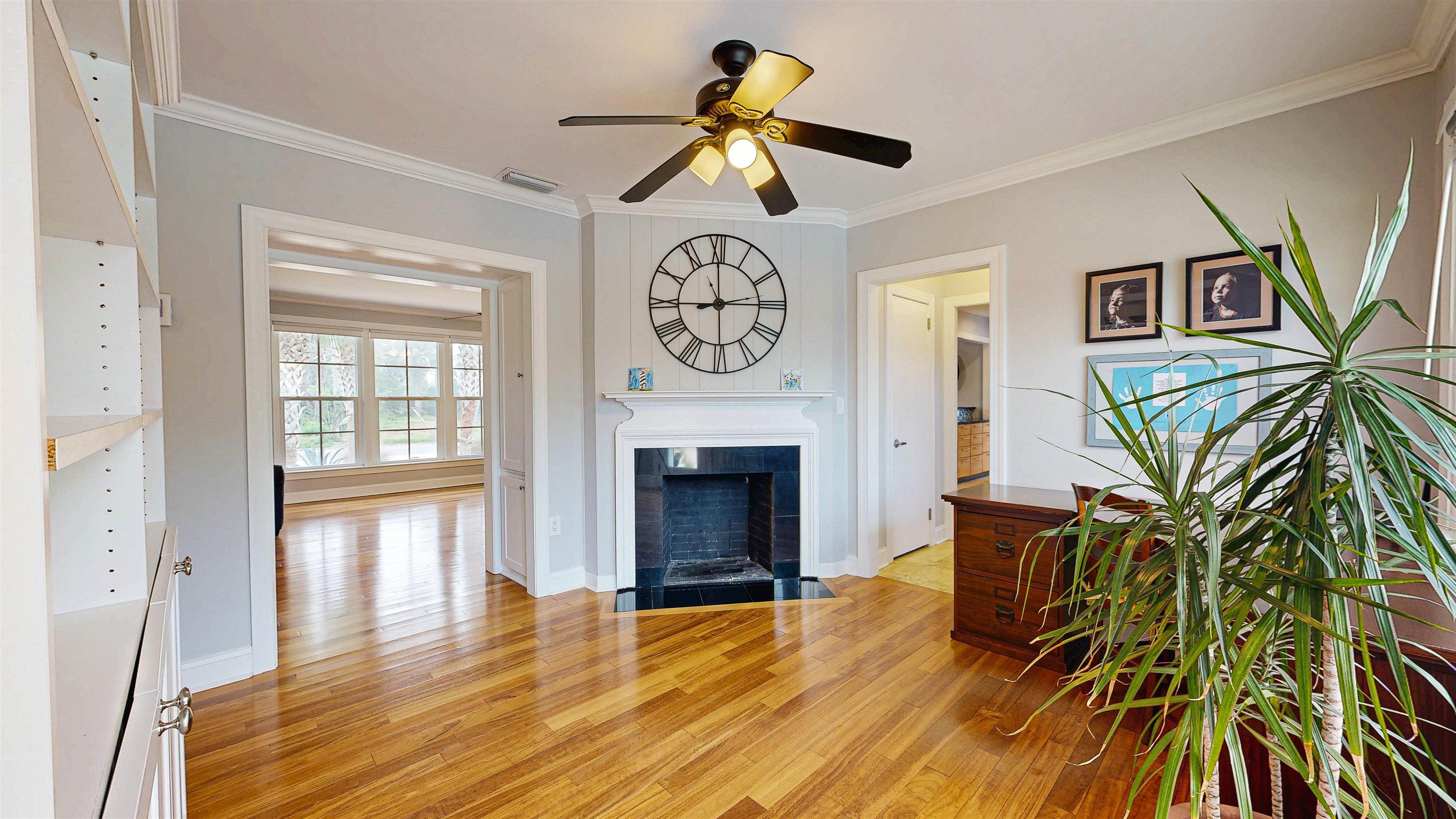 312 Minorca Avenue St. Augustine, FL 32080 - Photo 18 of 56 a living room with a fireplace with wooden floor