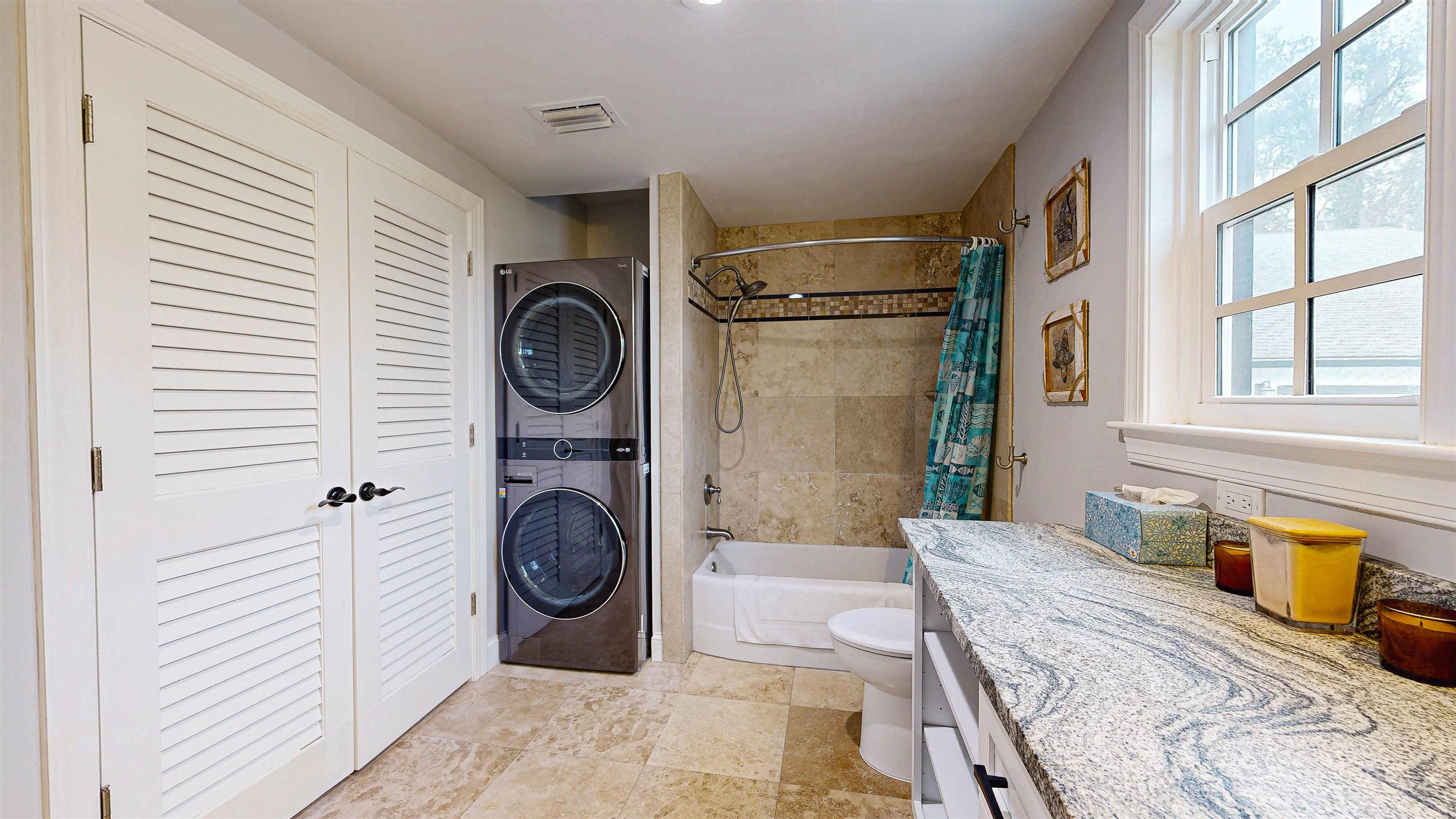 312 Minorca Avenue St. Augustine, FL 32080 - Photo 22 of 56 a spacious bedroom with a bed and a window