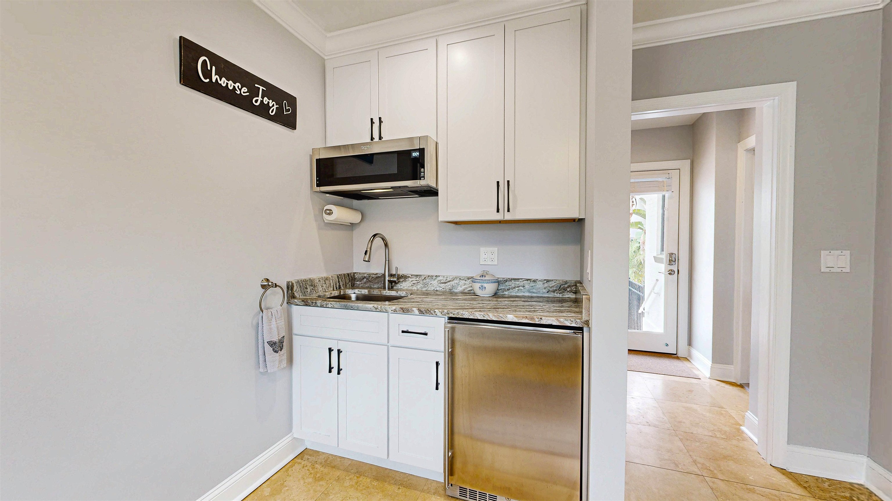 312 Minorca Avenue St. Augustine, FL 32080 - Photo 25 of 56 a kitchen with stainless steel appliances granite countertop a stove a sink and a refrigerator