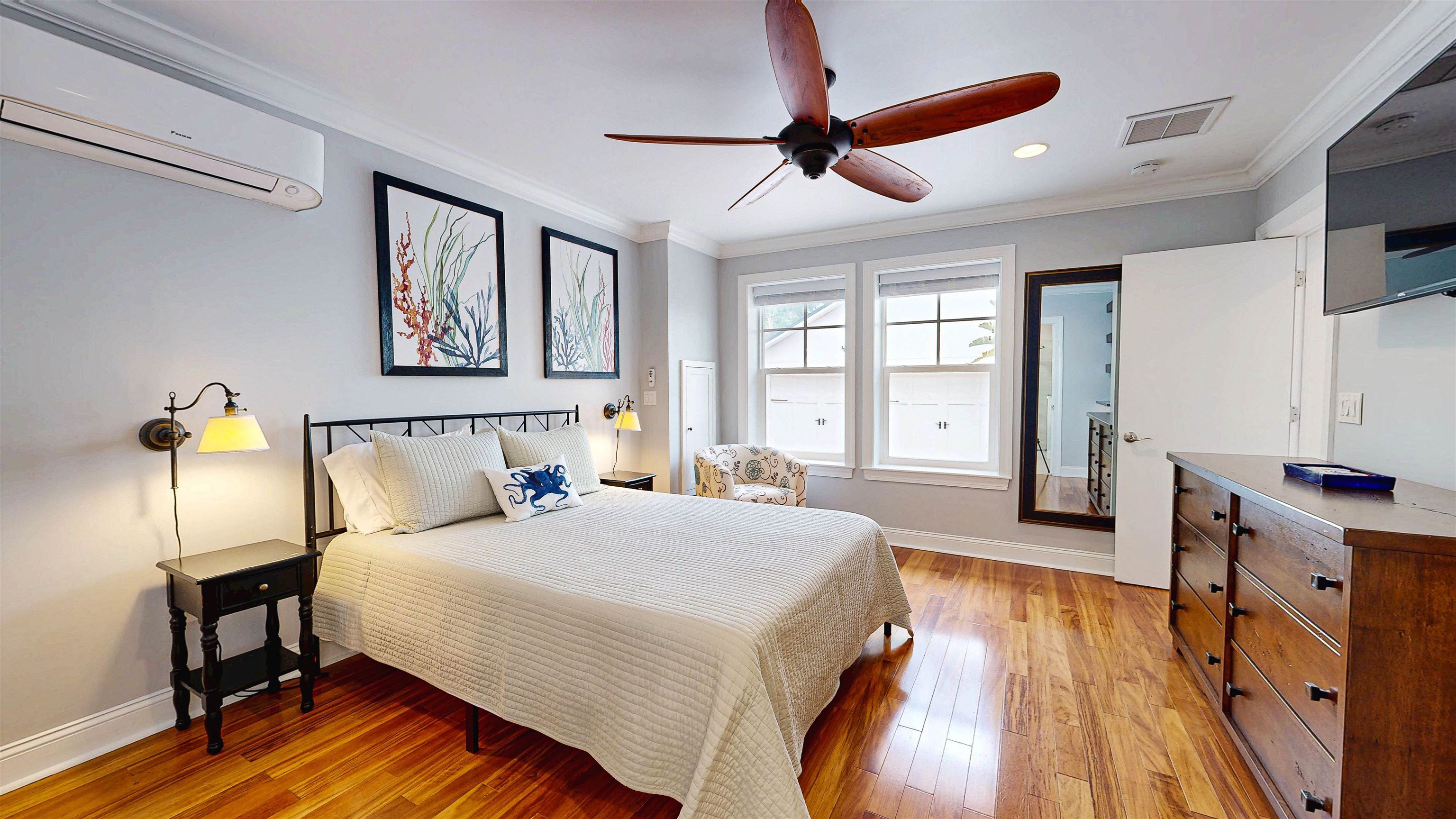 312 Minorca Avenue St. Augustine, FL 32080 - Photo 26 of 56 a spacious bedroom with a bed and a table