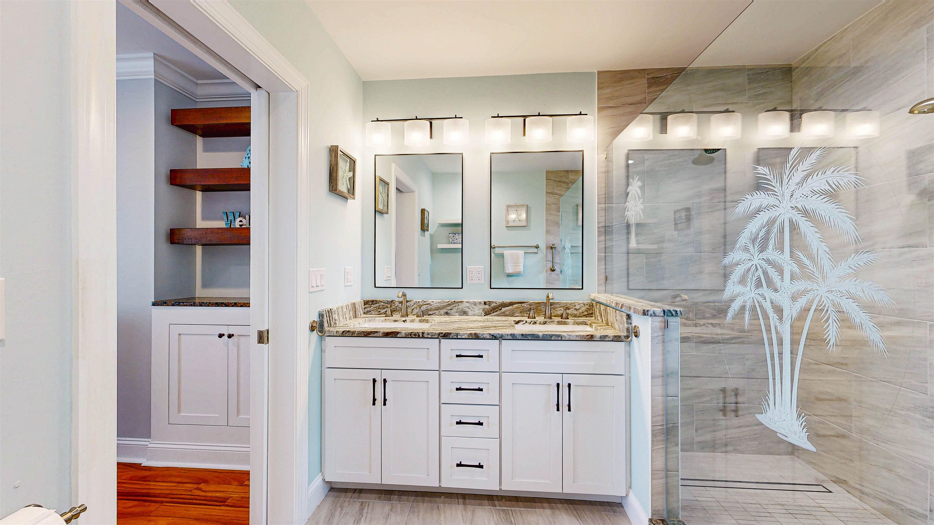 312 Minorca Avenue St. Augustine, FL 32080 - Photo 29 of 56 a bathroom with a granite countertop sink and a mirror
