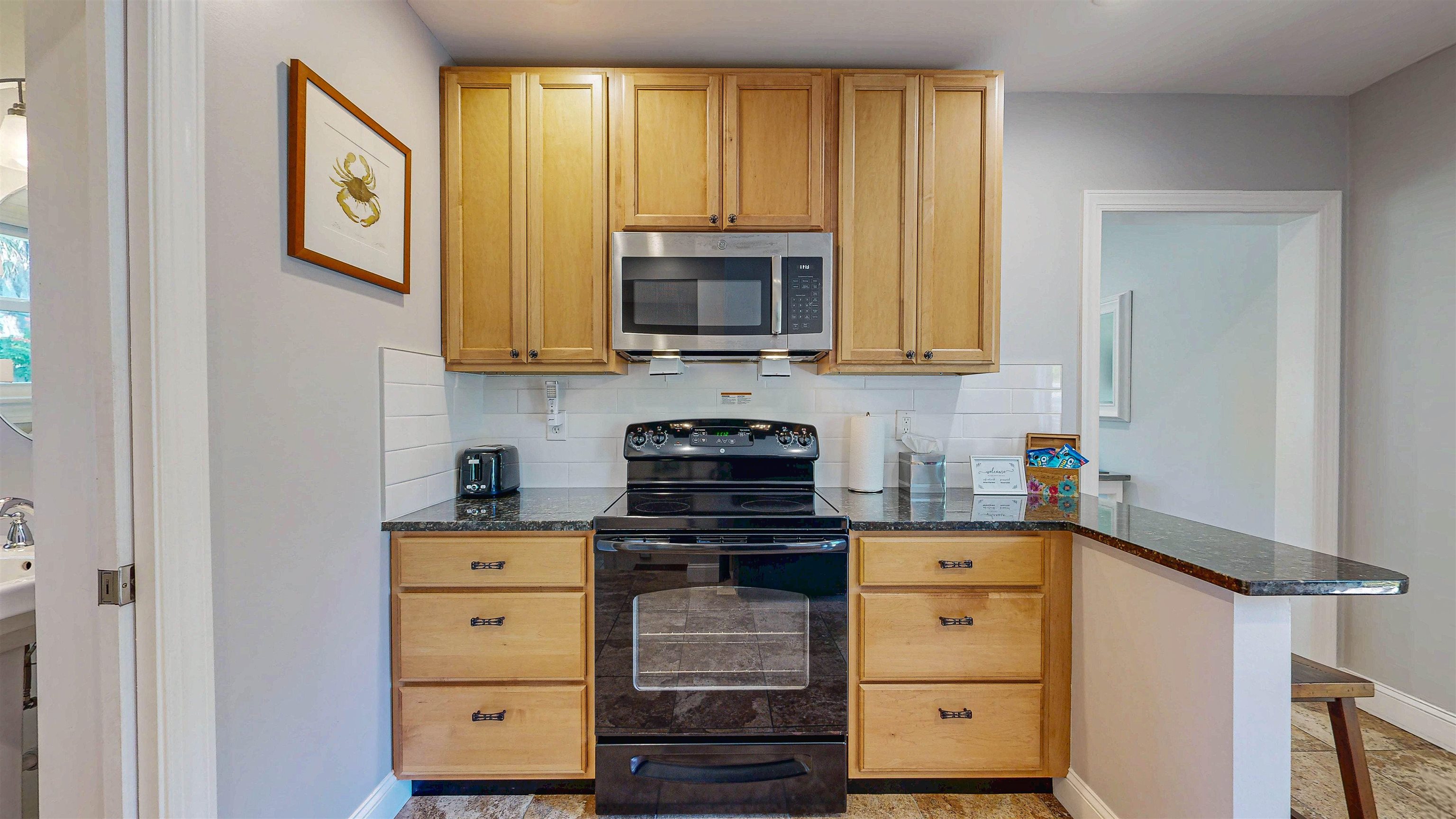 312 Minorca Avenue St. Augustine, FL 32080 - Photo 36 of 56 a kitchen with a stove and a microwave