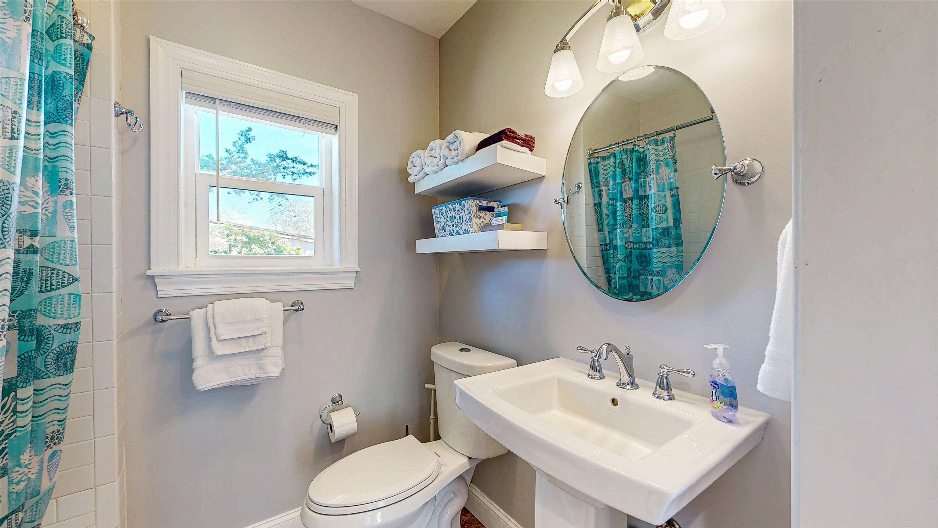 312 Minorca Avenue St. Augustine, FL 32080 - Photo 40 of 56 a bathroom with a toilet sink and mirror