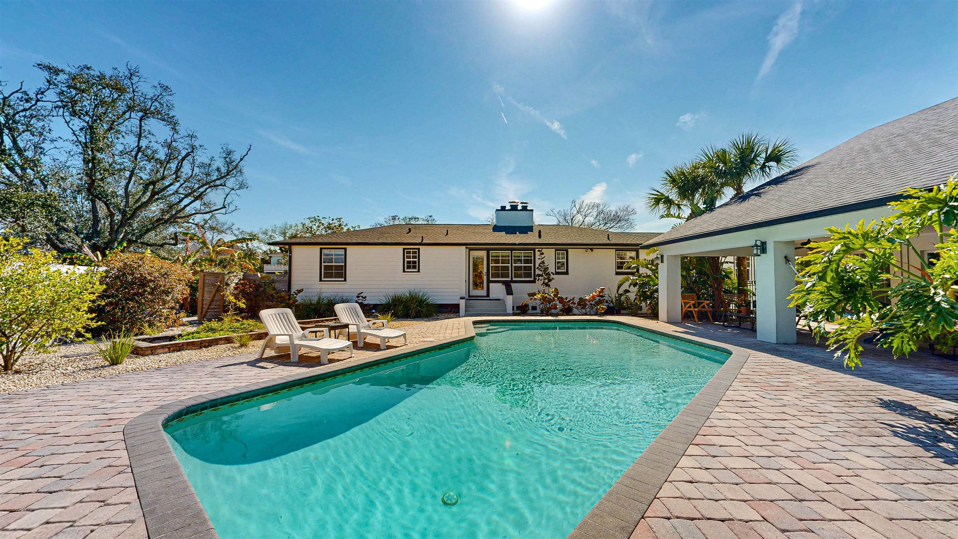 312 Minorca Avenue St. Augustine, FL 32080 - Photo 45 of 56 a view of a house with backyard sitting area and garden