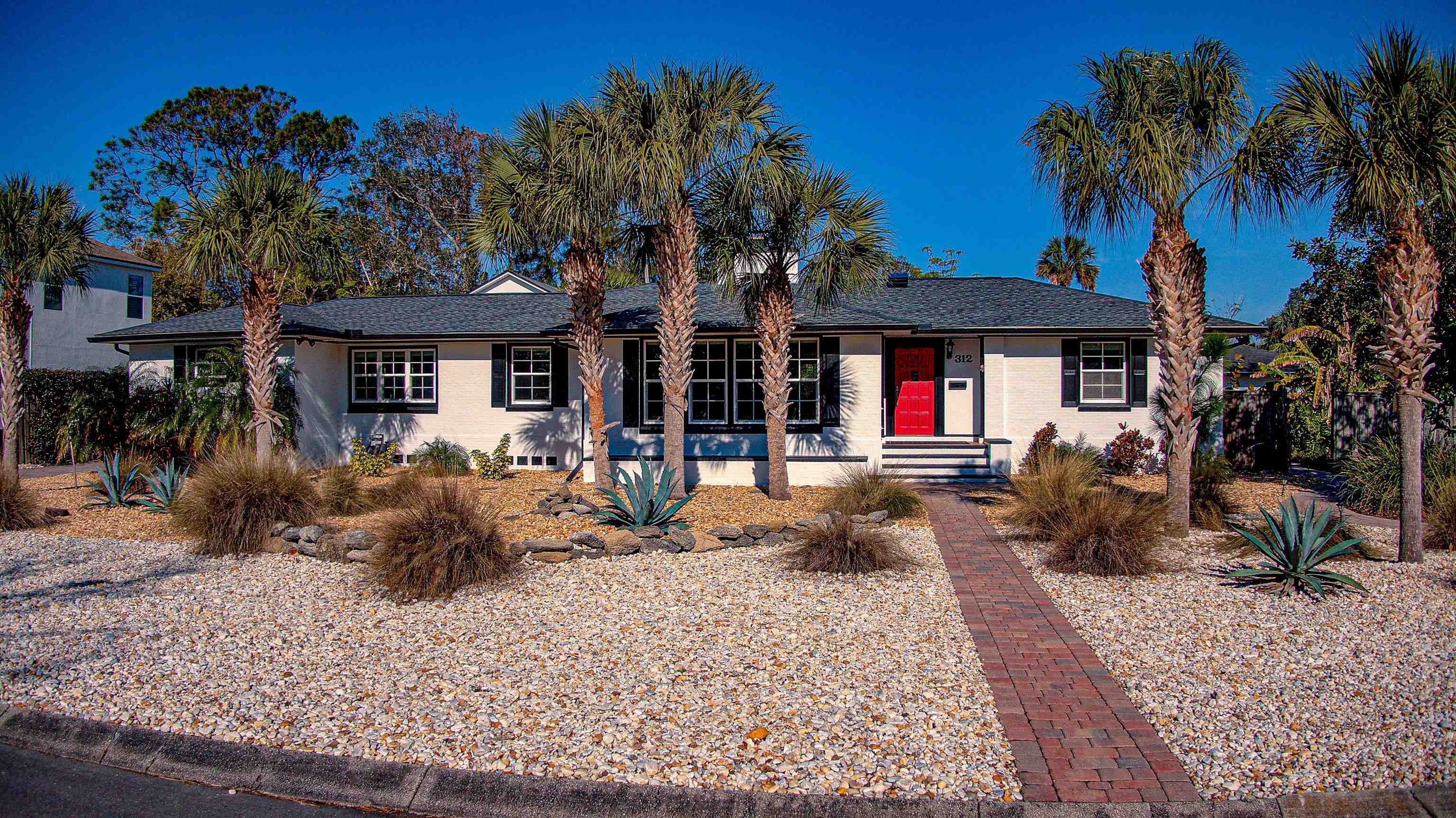 312 Minorca Avenue St. Augustine, FL 32080 - Photo 47 of 56 a front view of a house with garden