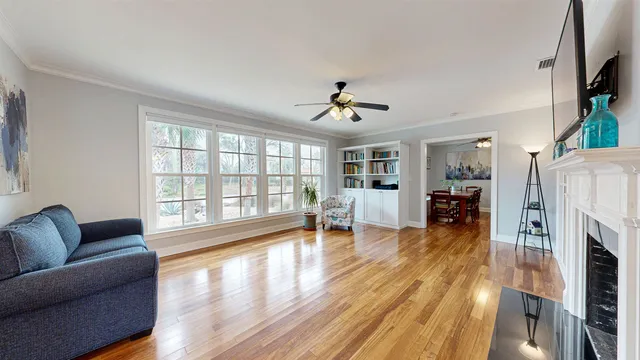 a living room with furniture and a fireplace