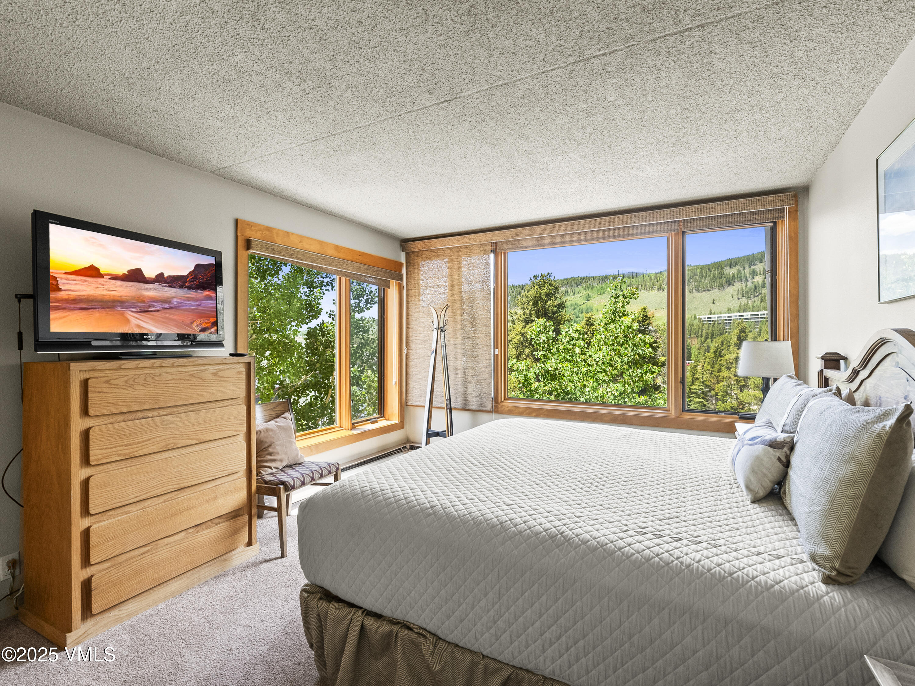 2340 Route 6, Unit 1794 Wellfleet, MA 02667 - Photo 12 of 20 a bedroom with a bed and large window