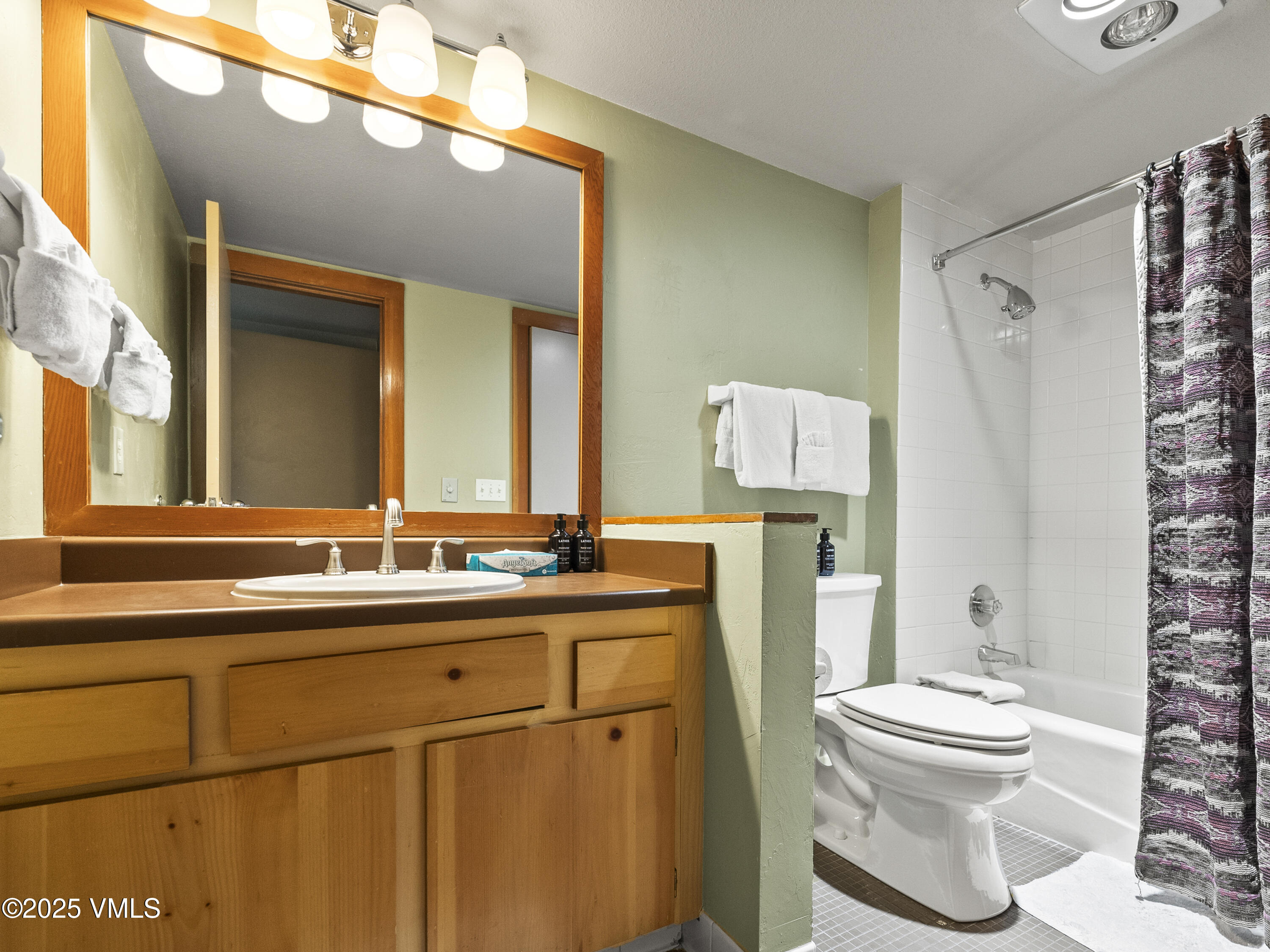 2340 Route 6, Unit 1794 Wellfleet, MA 02667 - Photo 15 of 20 a bathroom with a toilet a sink and a mirror