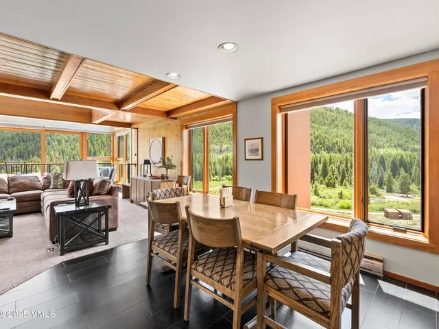 a view of a dining room with furniture window and outside view