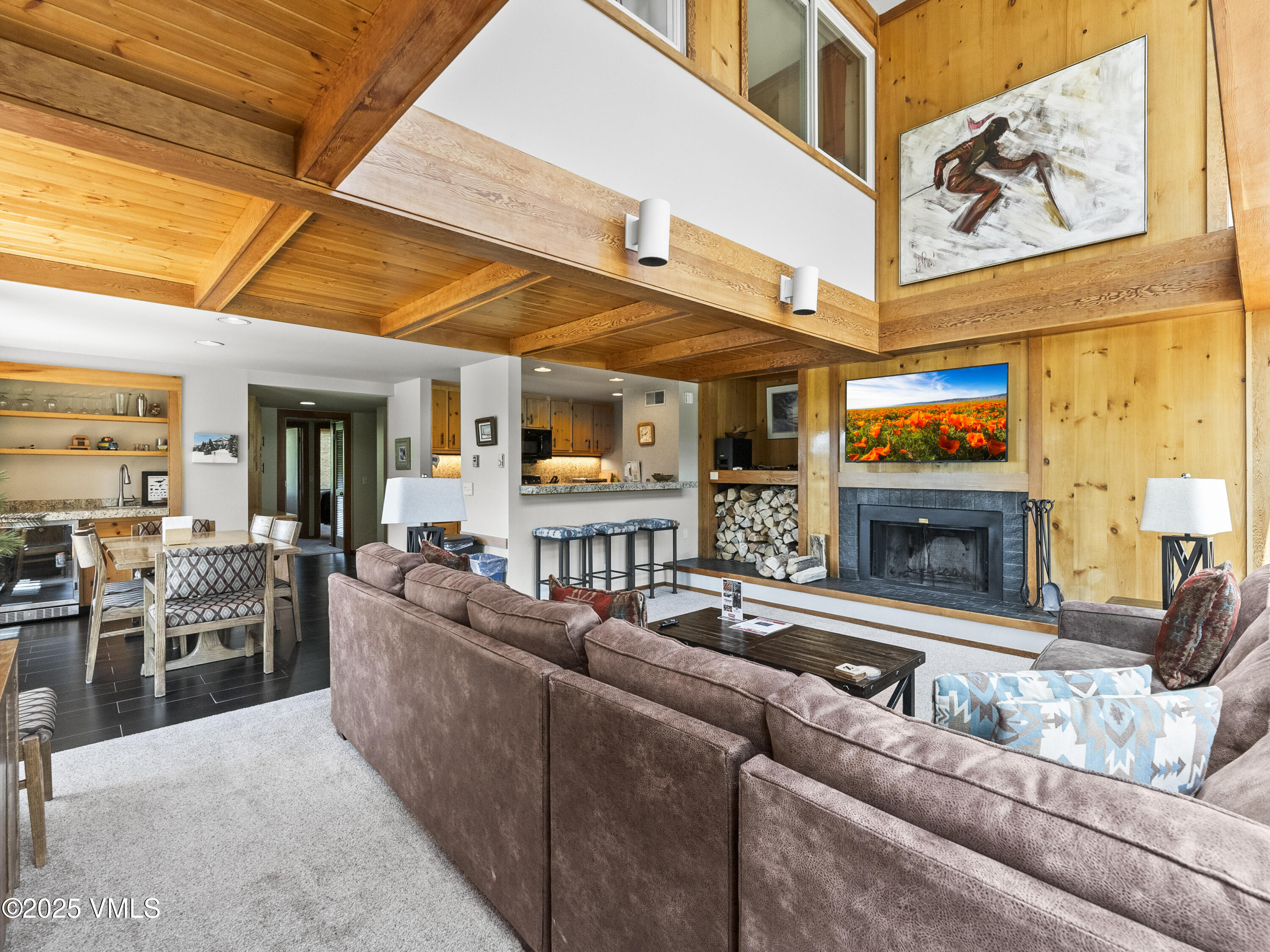 2340 Route 6, Unit 1794 Wellfleet, MA 02667 - Photo 6 of 20 a living room with furniture a fireplace and kitchen view