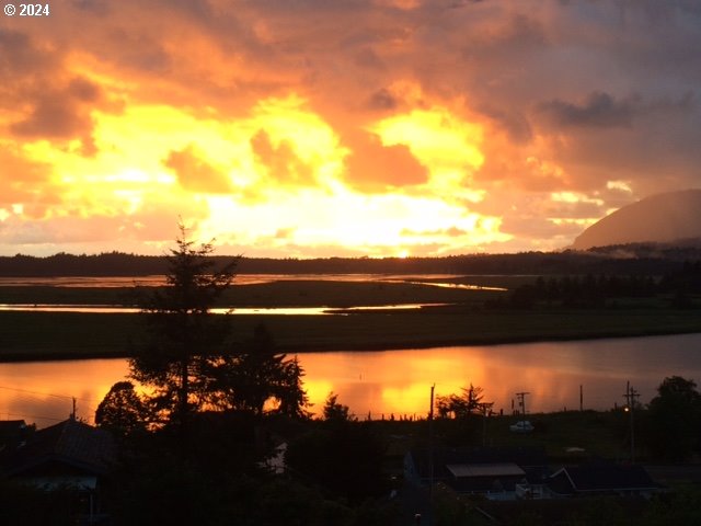 Spruce Street Wheeler, OR 97147 - Photo 4 of 15 a view of a city and sunset