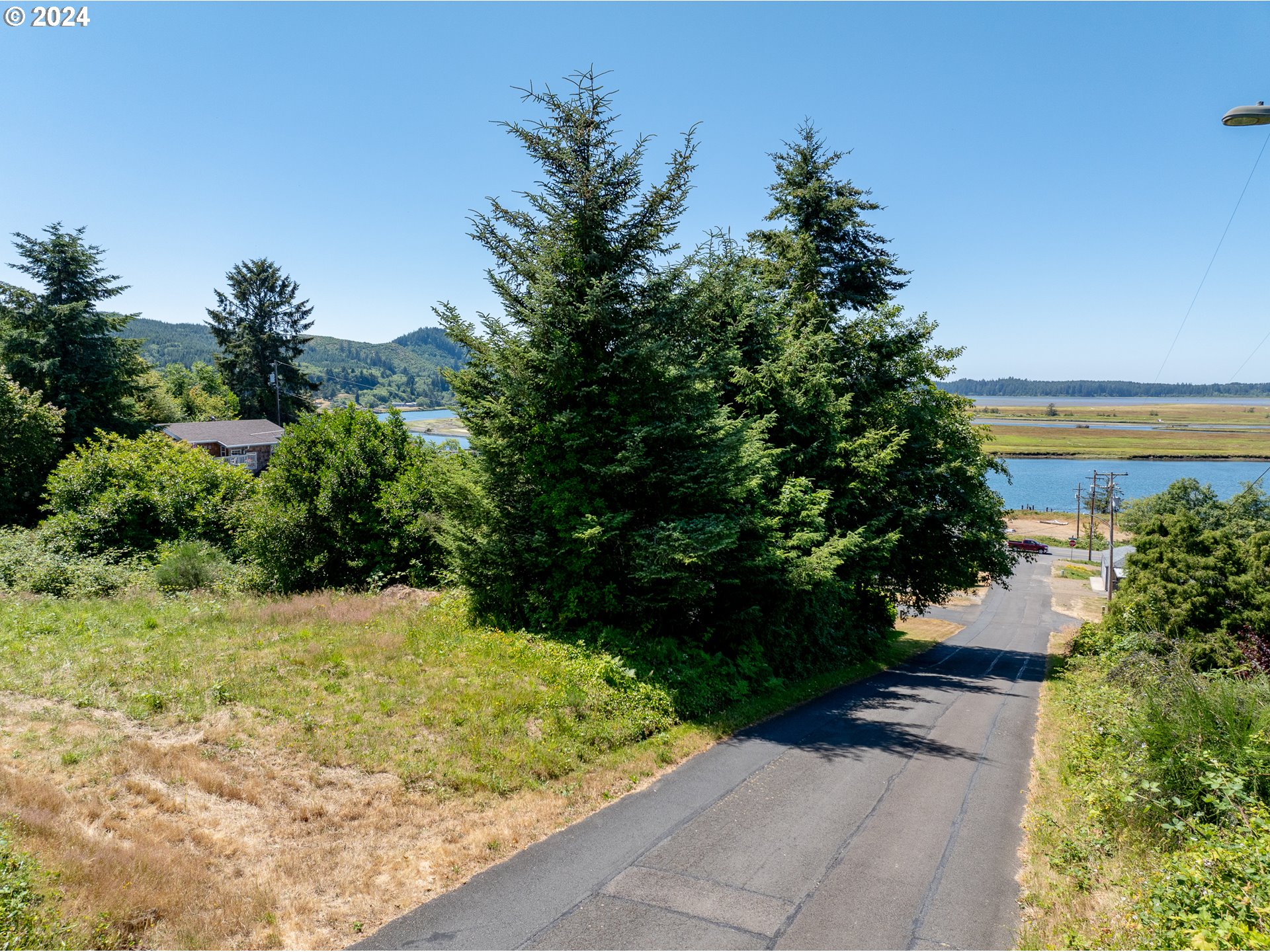 Spruce Street Wheeler, OR 97147 - Photo 9 of 15 a view of backyard with garden