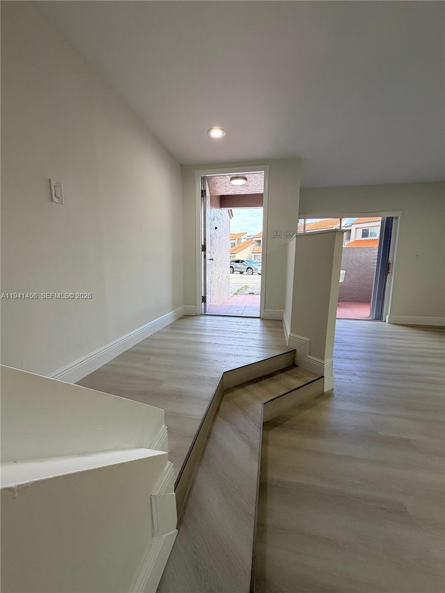 6514 Southwest 128th Place, Unit 6514 Miami, FL 33183 - Photo 18 of 18 a view of empty room with wooden floor