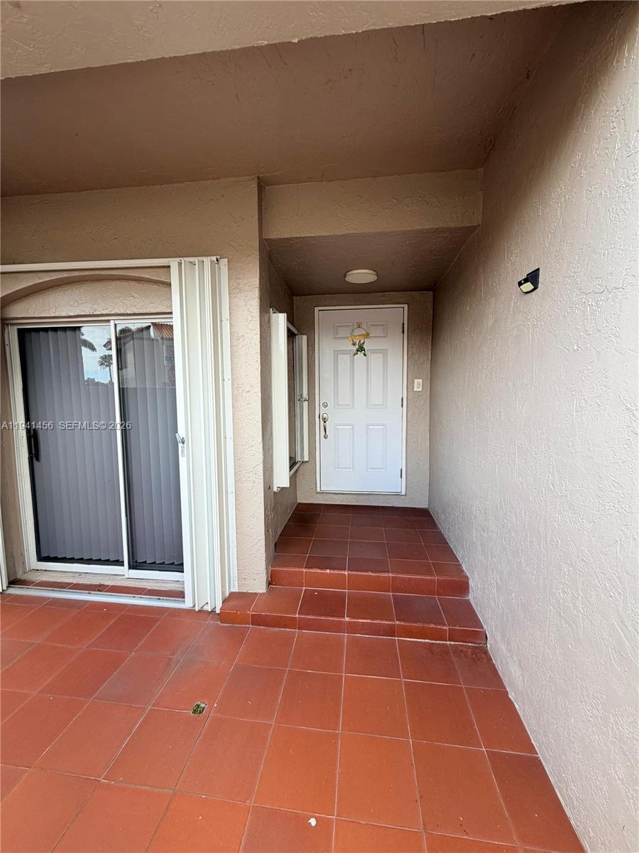 6514 Southwest 128th Place, Unit 6514 Miami, FL 33183 - Photo 2 of 18 a view of an empty room with windows