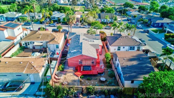 an aerial view of houses with yard