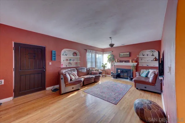 a living room with furniture and a fireplace