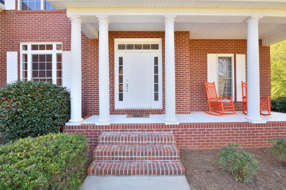 114 Bancroft Court Central, SC 29630 - Photo 3 of 35 Welcome to 114 Bancroft with a rocking chair front