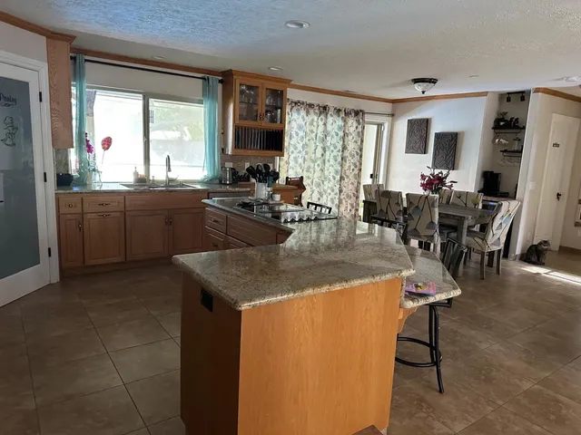 a view of a dining room with furniture and window