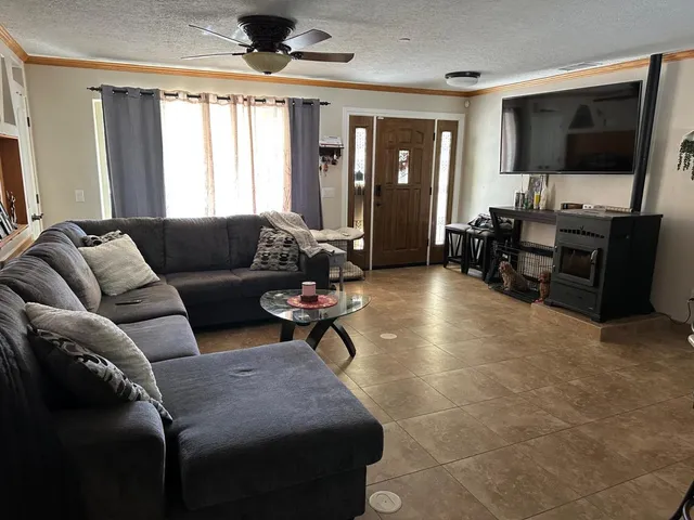 a view of bedroom with furniture and a window
