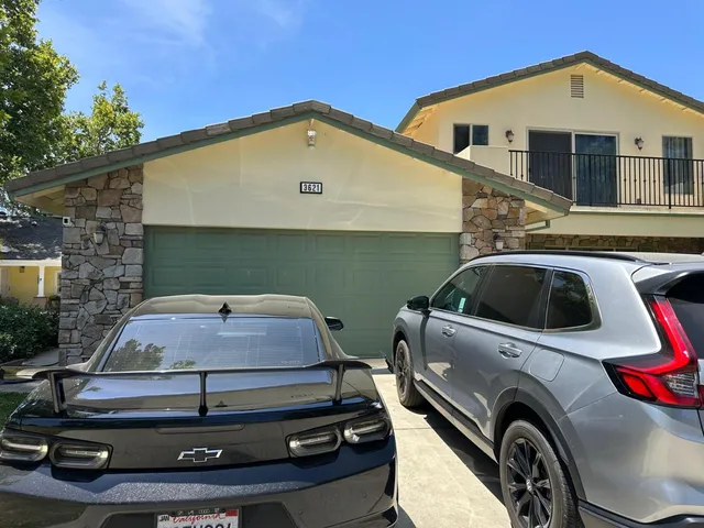 a front view of a house with parking space