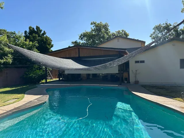 a bathroom with a tub and a shower
