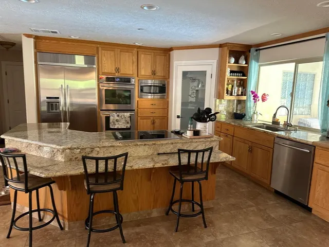 a kitchen with granite countertop a sink and counter space