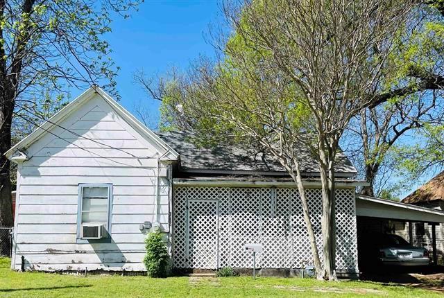 1716 Maple Avenue Paris, TX 75460 - Photo 1 of 1 a front view of a house with a yard