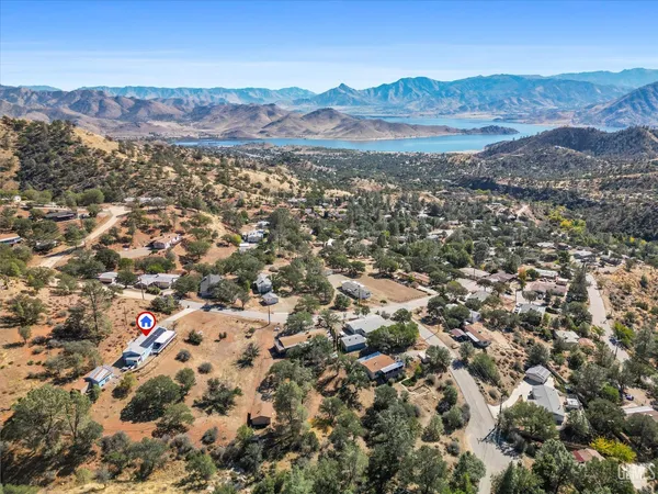 an aerial view of residential house and green space