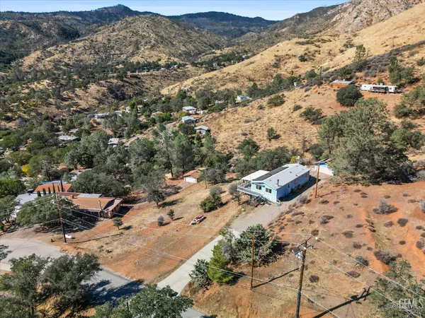 an aerial view of house with yard